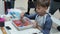 five-year-old boy engaged in art therapy draws in the technique of Ebru. Russia, Saratov-September, 2019