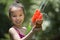 Five year old girl playing with squirt toy