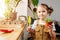 Five year old girl posing for a photo with a pot and gardening shovel in hands