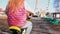 Five-year-old little blonde girl riding bike in an old park.