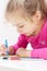 Five years old caucasian blond child girl drawing picture