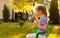 Five years old child girl child girl blowing soap bubbles outdoor