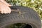 Fix flat car tire. Car tire damage with nail