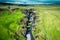 Fjadrargljufur rugged canyon naturally eroded with Fjadra river flowing in summer at Iceland