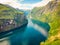 Fjord Geirangerfjord with ferry boat, Norway