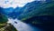 Fjord Geirangerfjord with ferry boat, Norway