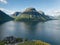 Fjord during spring sunset with calm waters - AI Generated