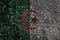 Flag of algeria on a old metal rusty cracked wall with text coronavirus, covid, and virus picture