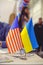 Flag of America and Ukraine on the table, business relations between countries