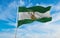 flag of Andalucia , Spain at cloudy sky background on sunset, panoramic view. Spanish travel and patriot concept. copy space for