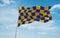 flag of Anglo-Frisian peoples Surrey people at cloudy sky background, panoramic view.flag representing ethnic group or culture,