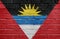 Flag of Antigua and Barbuda on brick wall