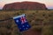 Flag of Australia against Uluru Ayers Rock at sunset Uluru-Kata Tjuta National Park Northern Territory Australia