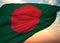 Flag of Bangladesh  waving in the wind with sunset sky background, close-up