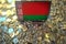 Flag of Belarus on the laptop screen and many bitcoins. National cryptocurrency regulations and crypto mining concepts