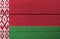 Flag of Belarus on wooden wall background. Grunge Belarus flag texture.