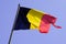Flag belgian National state belgium black red yellow on wind mat with blue cloud sky