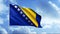 Flag of Bosnia And Herzegovina on flowing clouds background. Motion. Beautiful waving flag of blue and golden colors