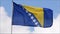 The flag of the Bosnia and Herzegovina waves in the wind in slow motion