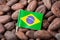 Flag of Brazil on cacao beans