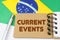 On the flag of Brazil lies a notebook with the inscription - current events