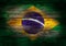 Flag of Brazil painted on grungy wood plank background