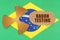 On the flag of Brazil, the symbol of radioactivity and torn cardboard with the inscription - Radon Testing