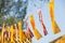 The flag of the Buddhist flags and Kingdom of Thailand flags on blue sky background in the evening with urban background. Thailand