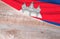 Flag Cambodia and space for text on a wooden background