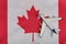 Flag of Canada and model airplane. Flights to Canada after quarantine. Resumption of flights