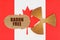 On the flag of Canada, the symbol of radioactivity and torn cardboard with the inscription - RADON FREE