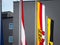 Flag of Carinthia, or Karntern, waiving in front of a flag of the city of Villach and a flag of Austria. Carinthia, or karnten