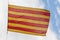 Flag Catalonia above blue sky