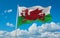 flag of Celtic peoples Welsh people at cloudy sky background, panoramic view. flag representing ethnic group or culture, regional