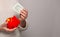 Flag of China on money bank in Chinese woman hands. Dotations, pension fund, poverty, wealth, retirement concept