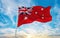 flag of Civil Ensign of Australia , Australia at cloudy sky background on sunset, panoramic view. Australian travel and patriot