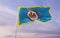 flag of county Fairfax, Virginia , USA at cloudy sky background on sunset, panoramic view. Patriotic concept about Fairfax,