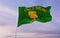 flag of county Oakland, Michigan , USA at cloudy sky background on sunset, panoramic view. Patriotic concept about Oakland,