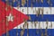 Flag of Cuba on a weathered wooden wall