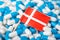 Flag of Denmark on piles of pills