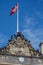 Flag and the detail of Amalienborg in Copenhagen