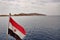 Flag of Egypt against the backdrop of the island of Tiran