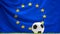 Flag of Europe soccer football ball background with green lawn 3