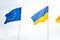 The flag of the European Union and Ukraine fluttering on the flagpole. Flags of Europe