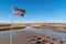 Flag flying over a boat dock