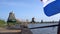 Flag on a foreground of Traditional Holland Windmills in Zaanse Schans, Netherlands. Touristic Village near the