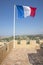 The flag of France flying from the Chateau Grimaldi, Haut de Cagnes, France