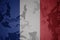 flag of france on the khaki texture . military concept