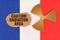 On the flag of France, the symbol of radioactivity and torn cardboard with the inscription - caution radiation area