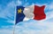 flag of French ancestry Acadians at cloudy sky background, panoramic view. flag representing extinct country,ethnic group or